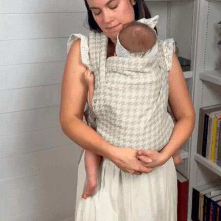 mom weareing snuggle carrier