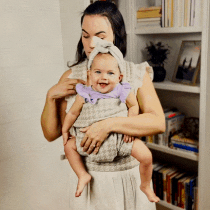 mom weareing snuggle carrier